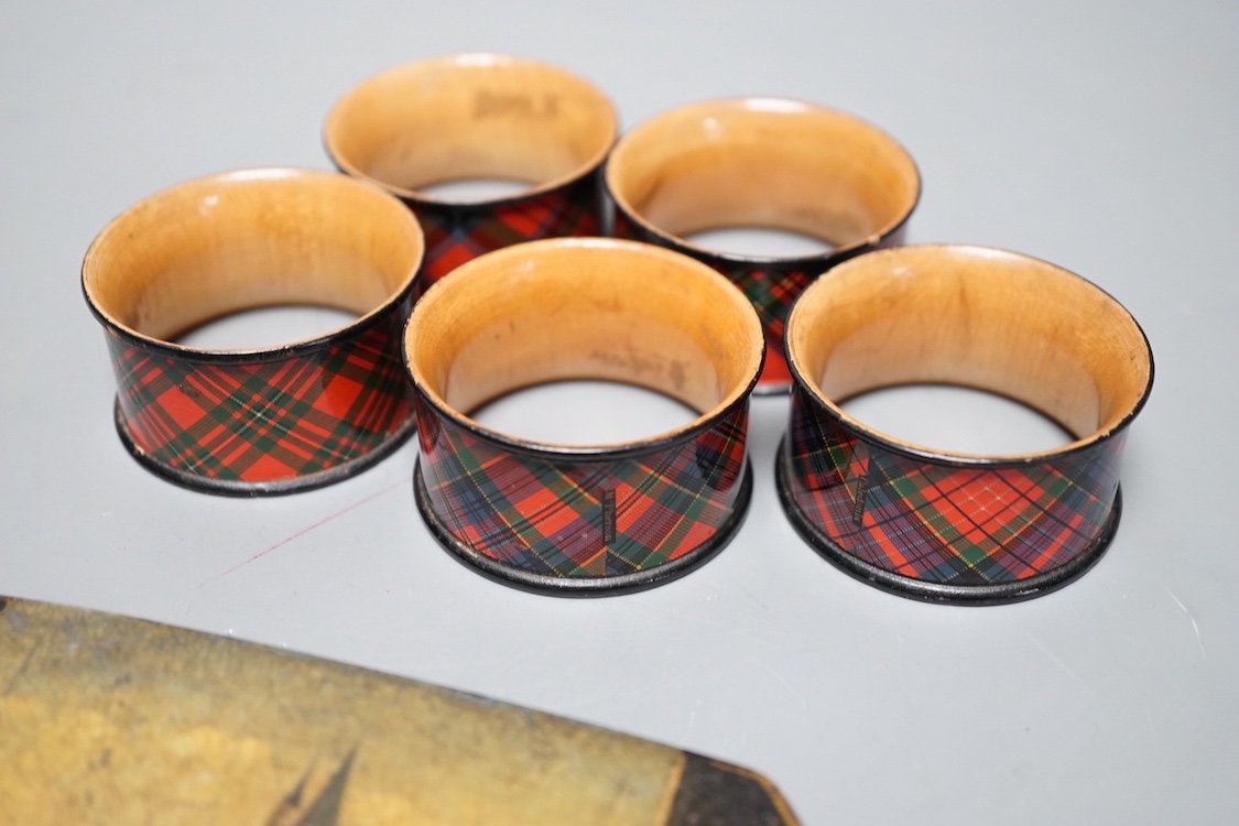 A German papier mache spectacles case and five Tartan ware napkin rings